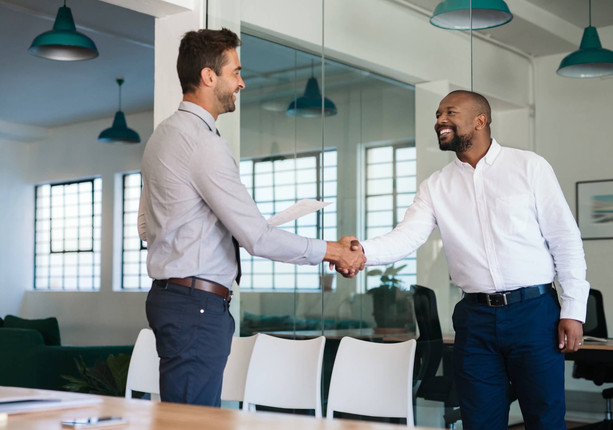 Two business men shake hands