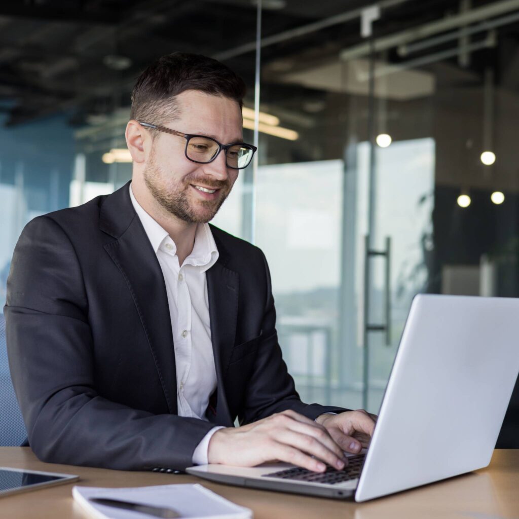 A bookkeeper works at his desk