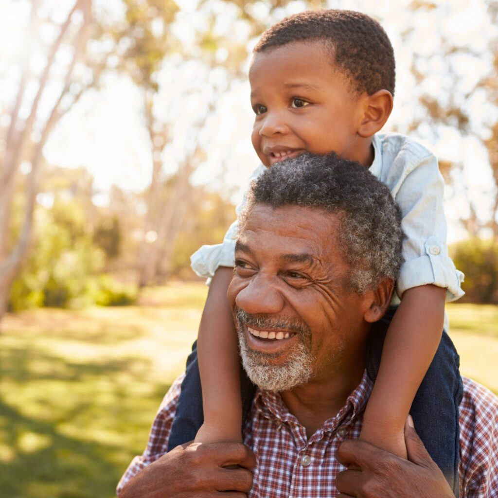 Grandfather and grandson smiling